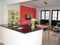 greeploze keuken in appartement te Turnhout granieten blad met onderbouw spoelbakken